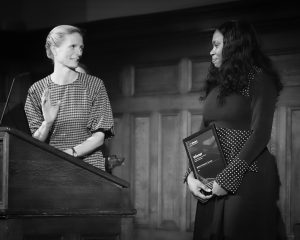 Image of two colleagues from British Antarctic Survey collecting their trophy and certificate.