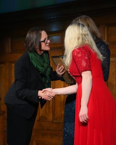 Colleagues from Browne Jacobson shaking hands with Jane Van Zyl from Working Families.