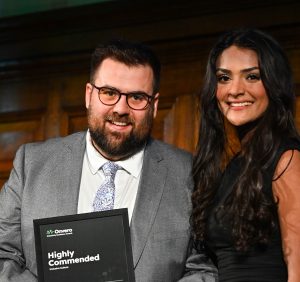 Colleagues from Police Now holding their certificate at the ceremony.